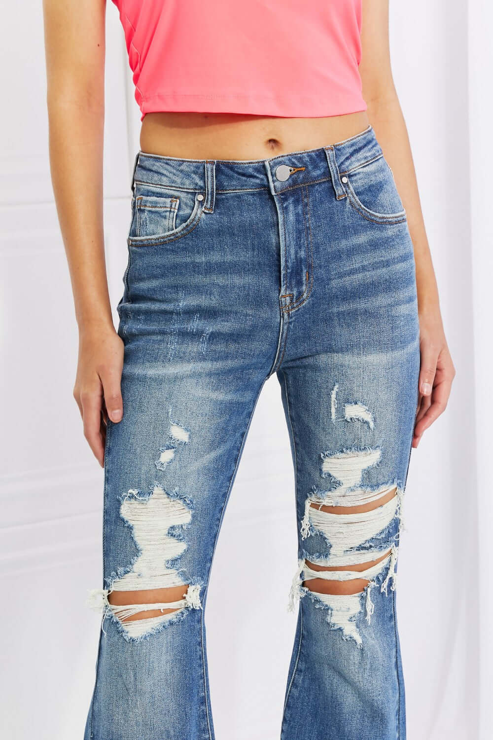 High Rise Distressed Flare Jeans with Frayed Hem and Lots of Stretch by Risen Jeans for a Rocker Style