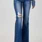 Distressed Button-Fly Flare Jeans by Risen Jeans – Washed Blue Denim, Slight Stretch, Pocketed for Effortless Style and Charm