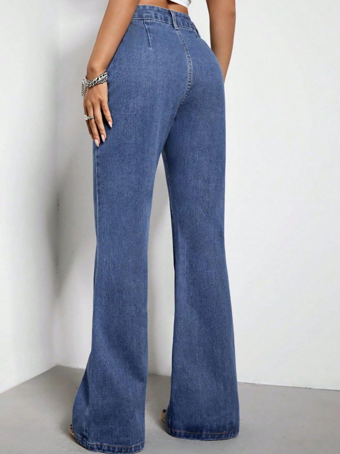 Woman wearing high waist bootcut jeans with pockets, rear view showcasing the fit and style of the denim.