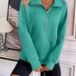 Ivy Lane Half Zip Raglan Sleeve Sweatshirt in teal green with front pocket and long sleeves.