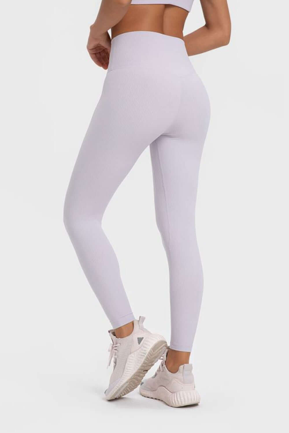 Millennia highly stretchy wide waistband yoga leggings in light purple, perfect for comfort and flexibility during workouts.