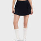 Stylish woman in a black mid-rise pleated active skirt, showcasing comfort and flair, perfect for any active lifestyle.