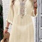 Fringe Tie Neck Three-Quarter Sleeve Cover Up in Cream with Embroidery and Sheer Fabric, Worn by Model Holding Hat