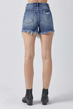 Back view of High Rise Distressed Denim Shorts by Risen Jeans, showing frayed hems and distressed detailing, perfect for summer chic style.