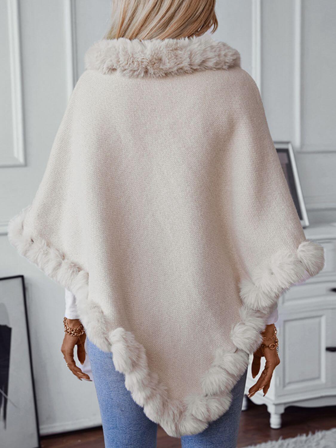 Cozy Bella Road three-quarter sleeve poncho with fuzzy trim, perfect for chilly days and stylish layering.