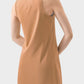 Model showcasing the back of the Millennia Round Neck Sleeveless Active Dress in a stylish tan color.