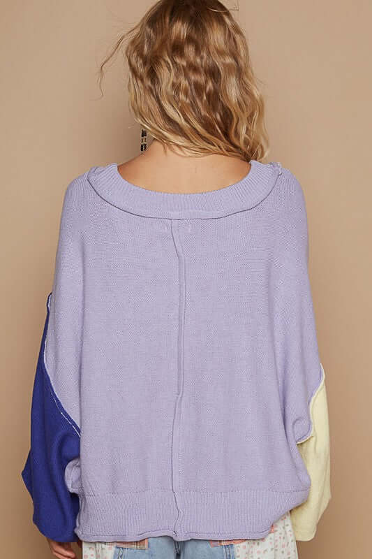 Back view of POL Exposed Seam Contrast V-Neck Lantern Sleeve Sweater in pastel colors, showcasing cozy knit and unique design.