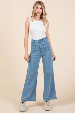 Woman wearing Mittoshop High Waist Wide Leg Jeans with front and back patch pockets in soft denim knit fabric for a chic look.