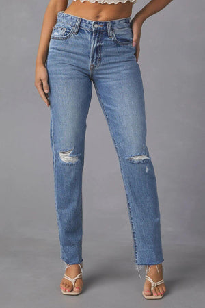 Distressed raw hem straight jeans with pockets and moderate stretch for a chic, casual look.