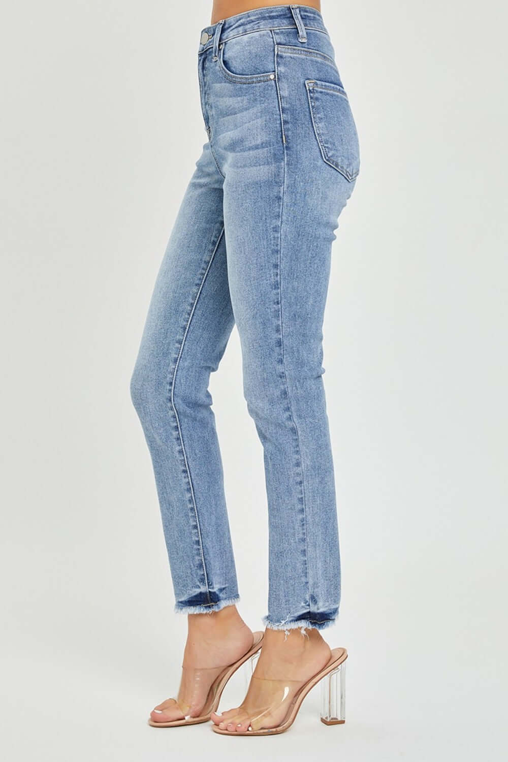 High rise frayed hem skinny jeans by Risen Jeans, showcasing trendy and versatile style with a flattering fit and edgy frayed hem.