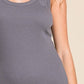 Woman wearing ribbed scoop neck tank top in gray showing ribbed texture and flattering fit. Perfect for versatile styling and layering.