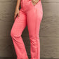 Woman wearing Kenya High Waist Side Twill Straight Jeans in vibrant pink, showcasing elegant Risen Jeans with twill tape detailing