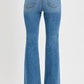 Back view of RISEN Plus Size Flare Jeans showcasing retro-inspired design and flared leg silhouette.