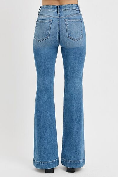 Back view of RISEN Plus Size Flare Jeans showcasing retro-inspired design and flared leg silhouette.