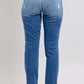 Back view of Judy Blue Plus Size Button Fly Distressed Jeans with Pockets, stylish and slightly stretchy.