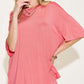 Woman wearing bamboo drop shoulder t-shirt and flare pants set in pink.