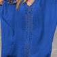 Woman wearing a blue Cutout V-Neck Three-Quarter Sleeve Cover Up on a beach.