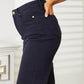 Woman wearing high waist tummy control Judy Blue wide cropped jeans in garment-dyed finish