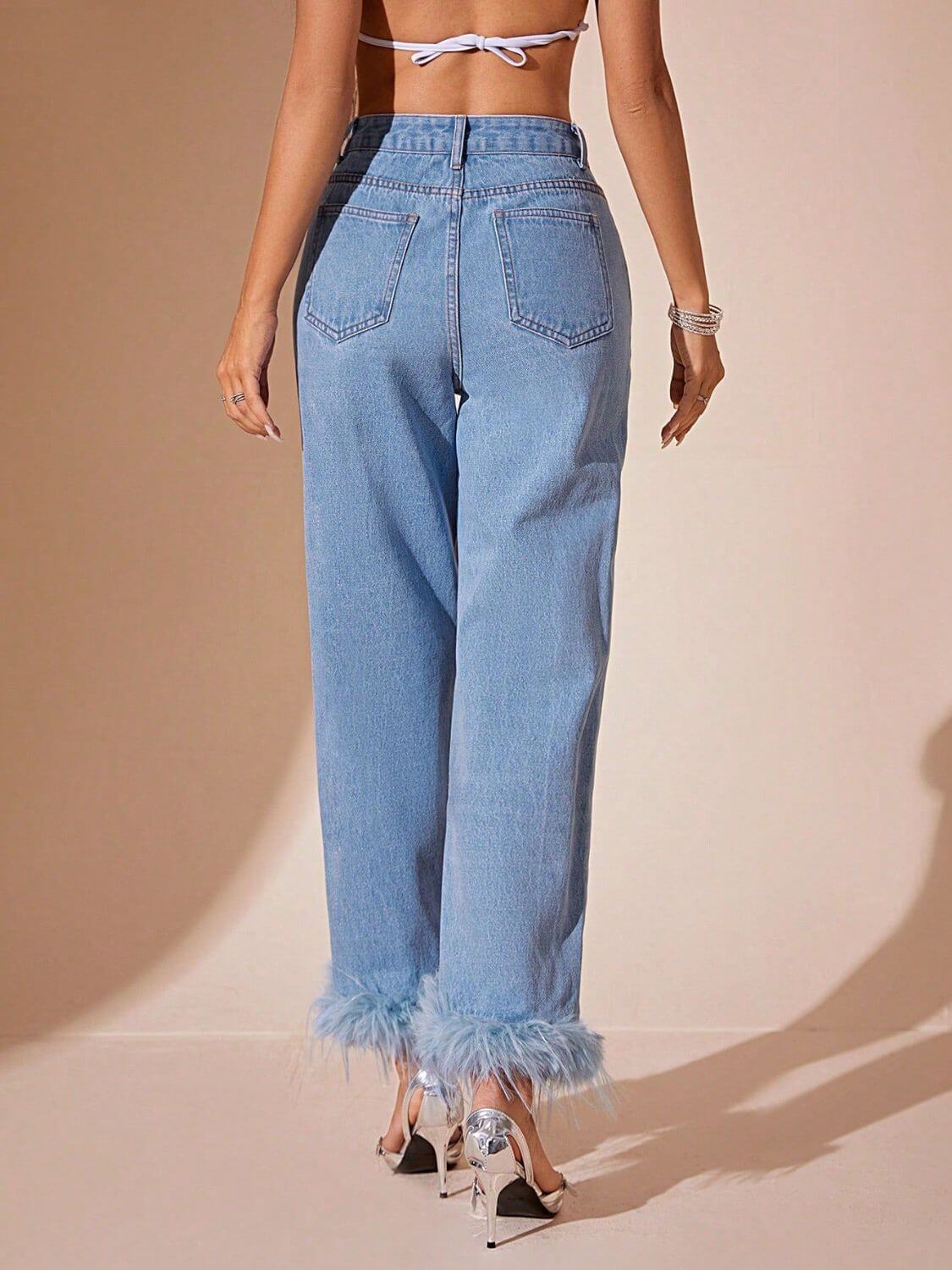 Back view of Bella Road Plush Hem High Rise Straight Jeans with stylish fringe hem and buttoned pockets.