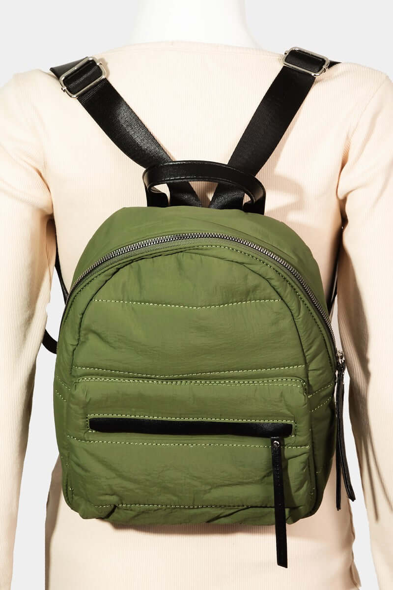 Stylish adjustable strap nylon backpack in olive green, perfect for daily use and travel with multiple compartments.