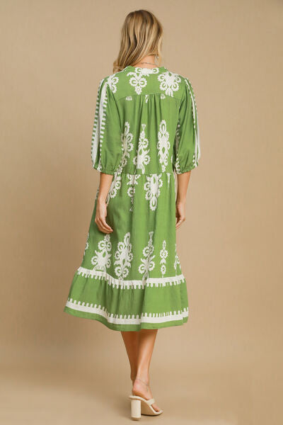 Back view of Umgee Printed Notched Midi Dress in green with white print, perfect for casual or semi-formal occasions.