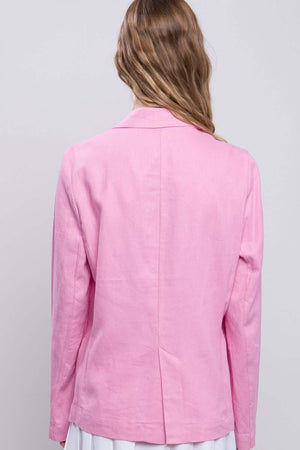 Back view of a woman wearing a pink One-Button Long Sleeve Linen Blazer, showcasing the classic and polished look of the blazer.