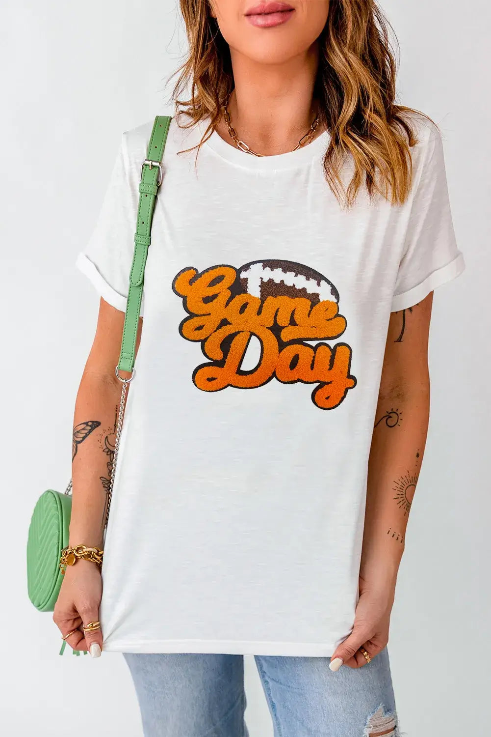 Woman wearing GAME DAY round neck short sleeve t-shirt with slightly stretchy polyester-cotton material and "Game Day" print in front.