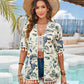 Stylish woman in floral tassel cover-up and hat at a beach, showcasing a playful summer vibe.