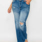 Model showcasing bytos Raw Hem Distressed Mid Rise Straight Jeans, featuring a trendy blue wash and edgy ripped details.