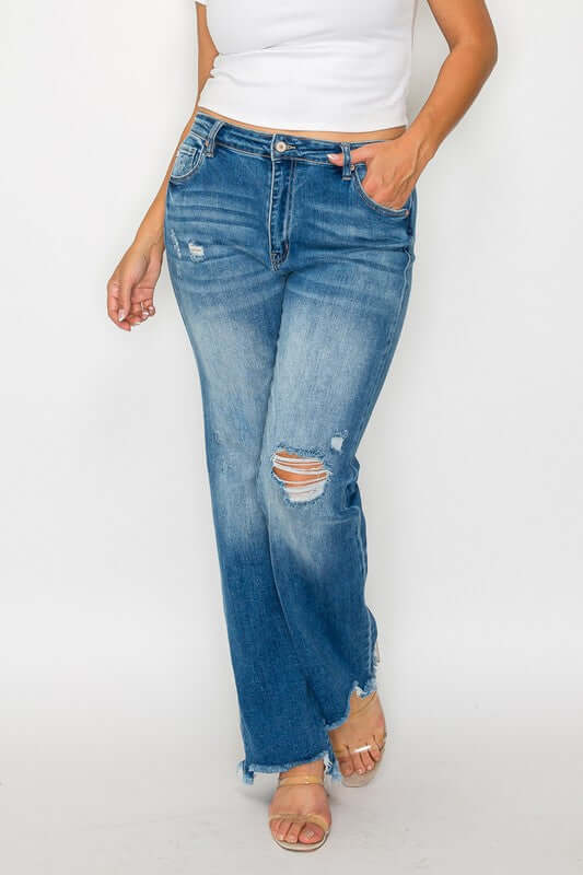 Model showcasing bytos Raw Hem Distressed Mid Rise Straight Jeans, featuring a trendy blue wash and edgy ripped details.