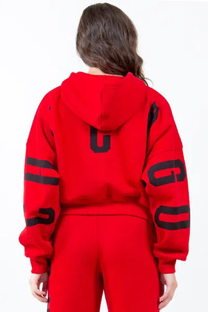 Back view of red American Bazi 'Chicago' cropped hoodie with drawstring and graphic design.