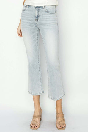 RISEN mid rise cropped flare jeans in light wash, featuring a mid-rise waist, highlighting footwear with a modern cropped length and retro flare.