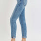 Woman wearing Risen Jeans High Rise Cropped Roll Up Jeans with high waistband, cropped length, and stylish rolled-up cuffs in quality denim.