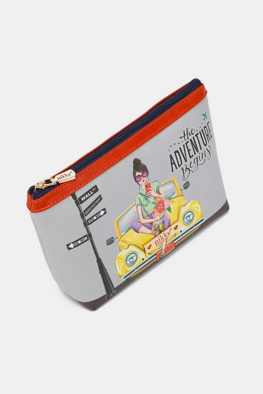 "Nicole Lee USA printed large cosmetic pouch with vibrant travel-themed design and secure zipper closure, ideal for organizing beauty essentials."