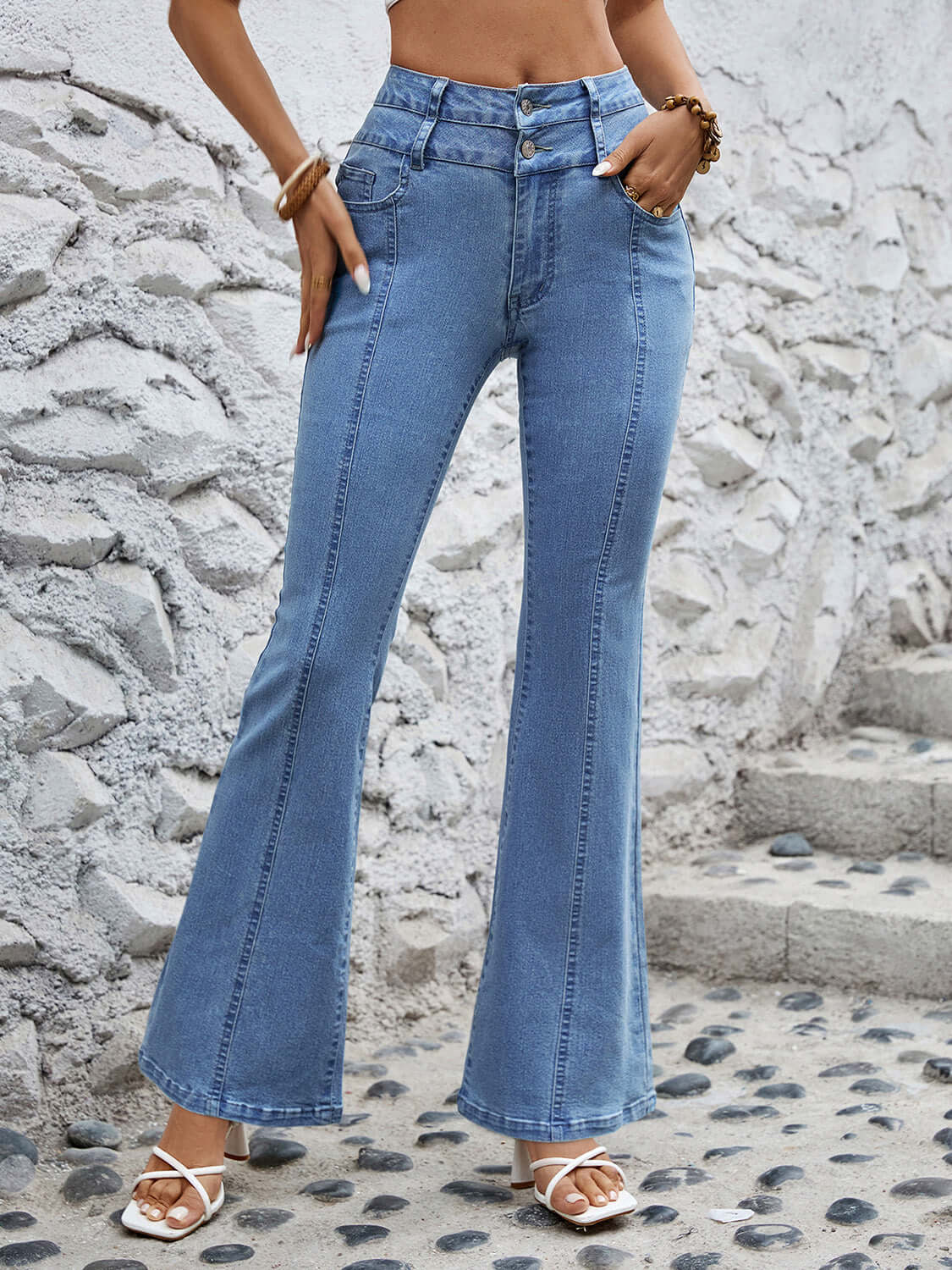 "Bella Road High Waist Flare Jeans in light wash with pockets, perfect for a retro look and versatile style."