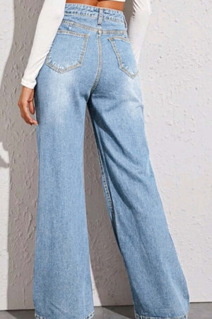 Back view of model wearing high waist wide leg jeans in light blue denim with no stretch, featuring back pockets and basic style.