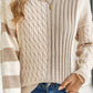 Woman wearing Bella Road cable-knit color block round neck sweater in tan, stylish and cozy fashion for cool days.