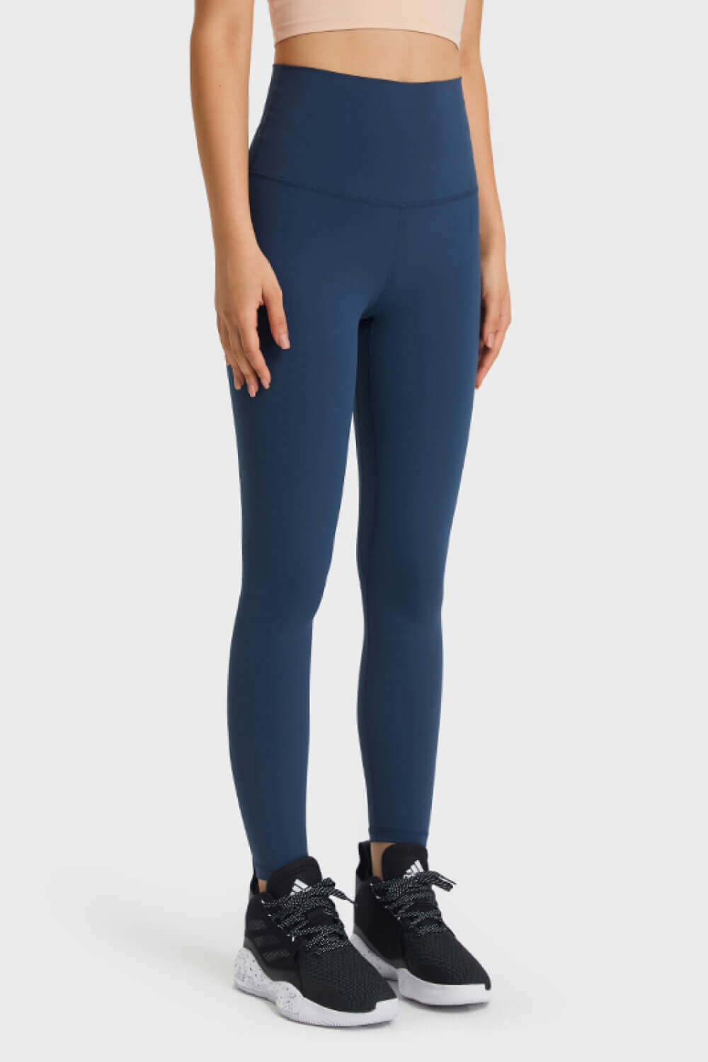 Model wearing Millennia Ultra Soft High Waist Leggings in navy, perfect for yoga and athleisure style.