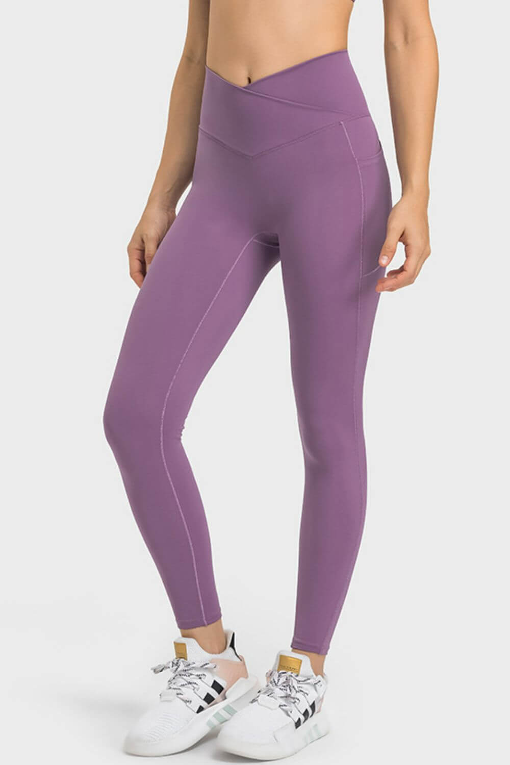 Stylish Millennia V-Waist Yoga Leggings in purple, featuring pockets and a flattering fit for your yoga practice.