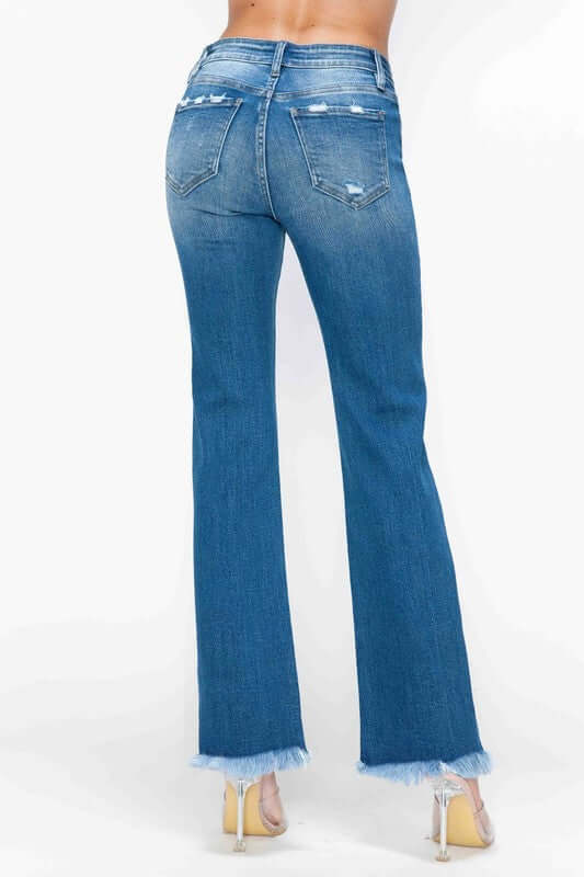 Back view of bytos Full Size Raw Hem Distressed Mid Rise Straight Jeans featuring a raw hem and stylish denim wash.