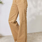 High-waisted tan fringe hem wide leg jeans by Risen Jeans with a slightly stretchy fit, perfect for casual or dressed-up occasions.