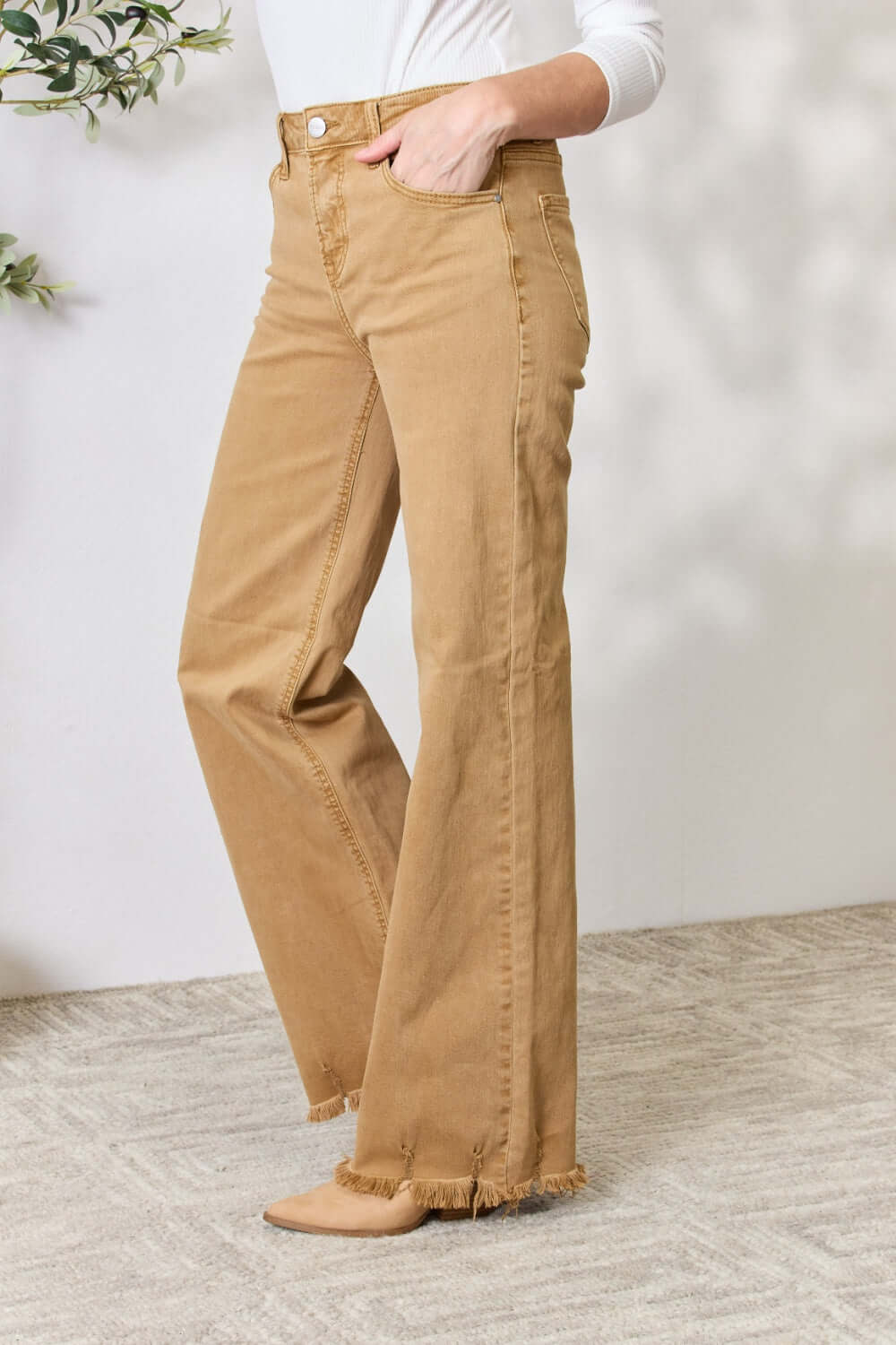 High-waisted tan fringe hem wide leg jeans by Risen Jeans with a slightly stretchy fit, perfect for casual or dressed-up occasions.