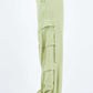 Side view of green linen wide leg cargo pants with relaxed fit and utility pockets