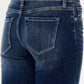 Mid-rise button fly flare jeans in medium wash showcasing back pockets and stretchy denim fabric.