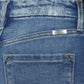 Close-up of Kancan high-rise slim straight jeans with frayed hem and wide waistband in medium stone wash denim.