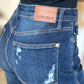 Close-up of High Waist Rigid Magic Heavy Destroy Judy Blue Jeans showcasing back pocket details and heavy distressing.