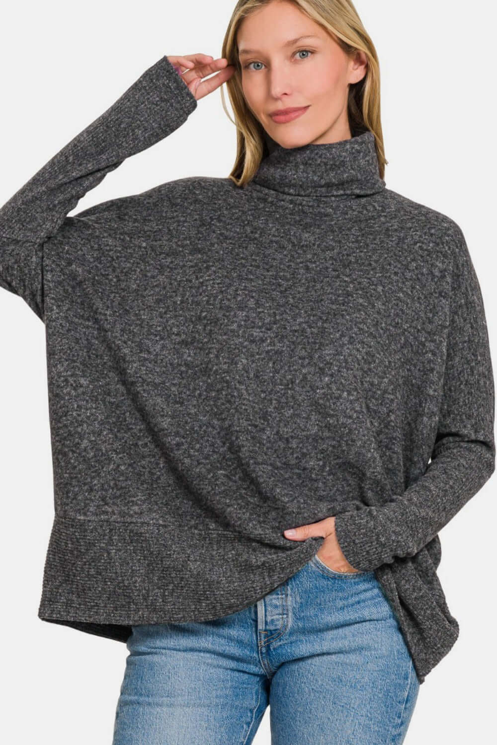 Cozy Zenana brushed melange hacci turtleneck sweater with elegant design, paired with jeans for stylish comfort.