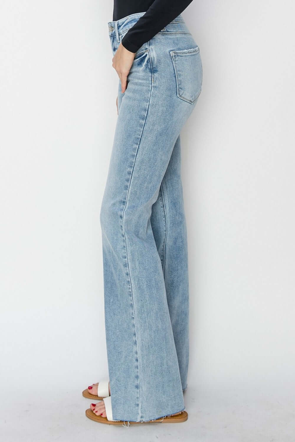 High Rise Raw Cut Hem Bootcut Risen Jeans - Side View of Chic and Trendy Denim