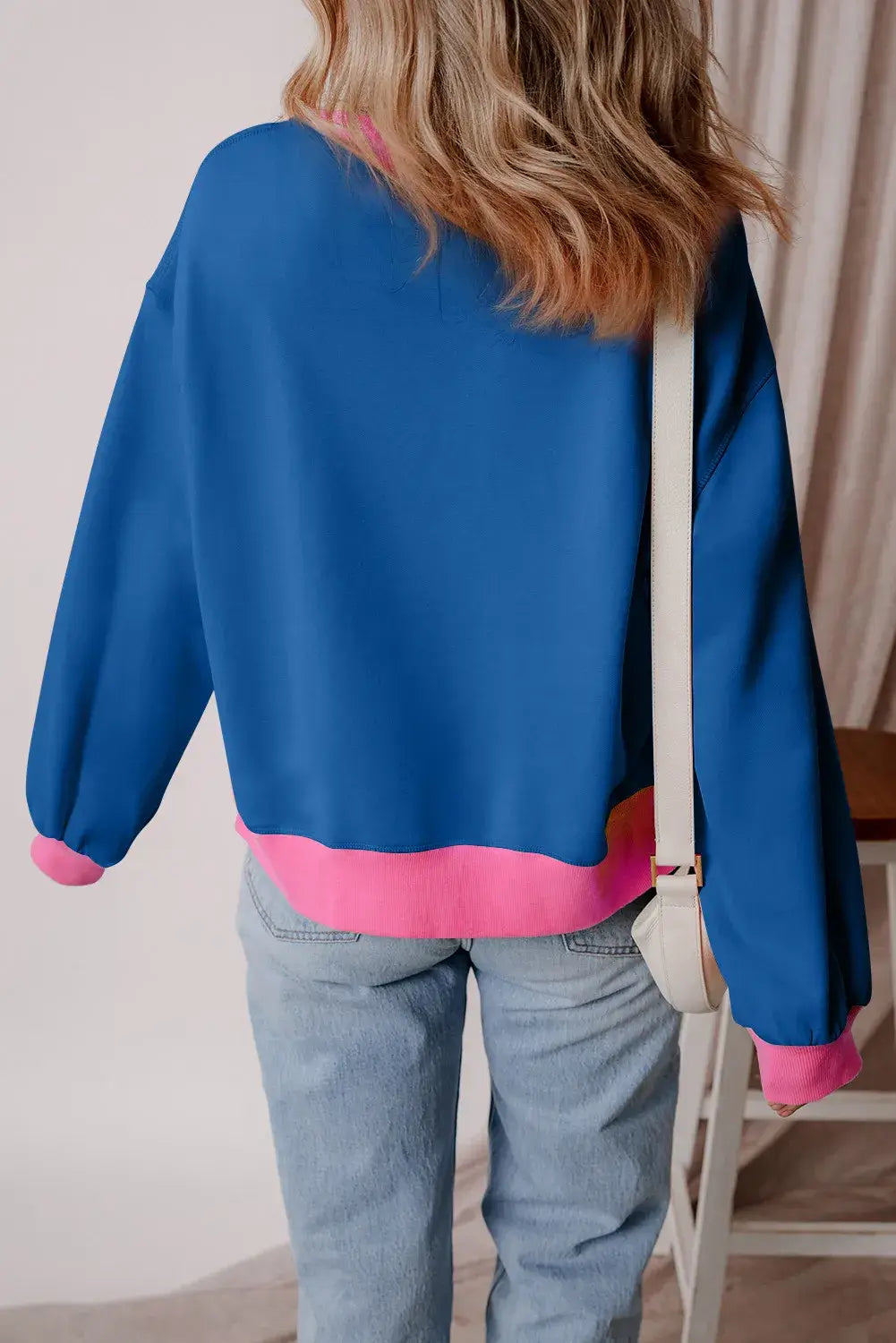 Back view of Bella Road Fall Graphic Contrast Long Sleeve Sweatshirt with blue and pink colors