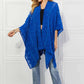 JUSTIN TAYLOR Pom-Pom Asymmetrical Poncho Cardigan in Blue at Bella Road